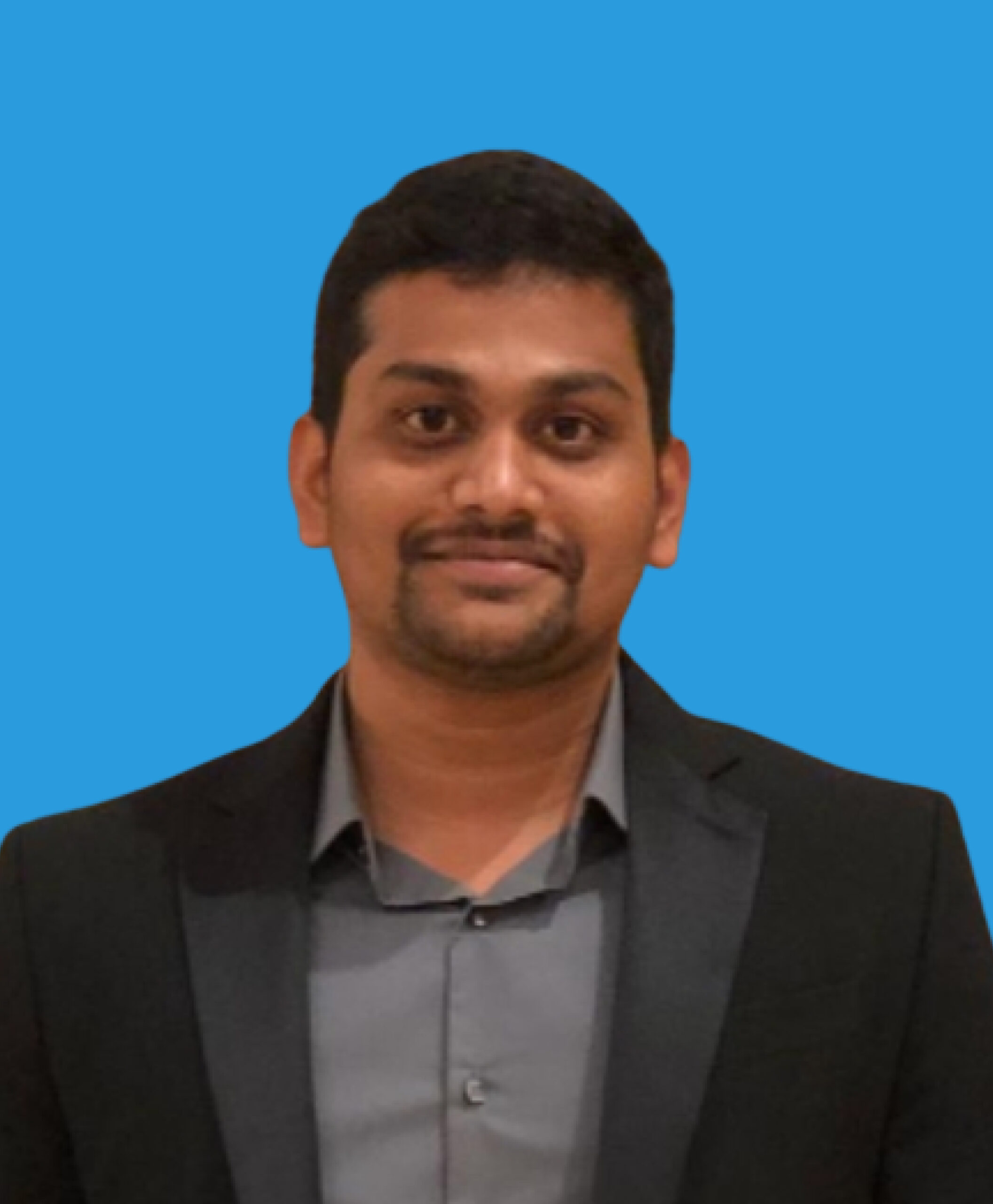 Jeevan Kadambala, team member at GMP Pros, wearing a black suit.