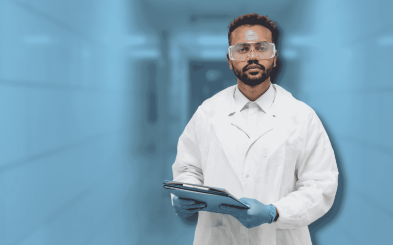 Image of a person in a lab coat and gloves holding a clipboard in a sterile environment. The background features a blue-toned laboratory hallway. Keyword: MES Implementation in Pharmaceutical Manufacturing.